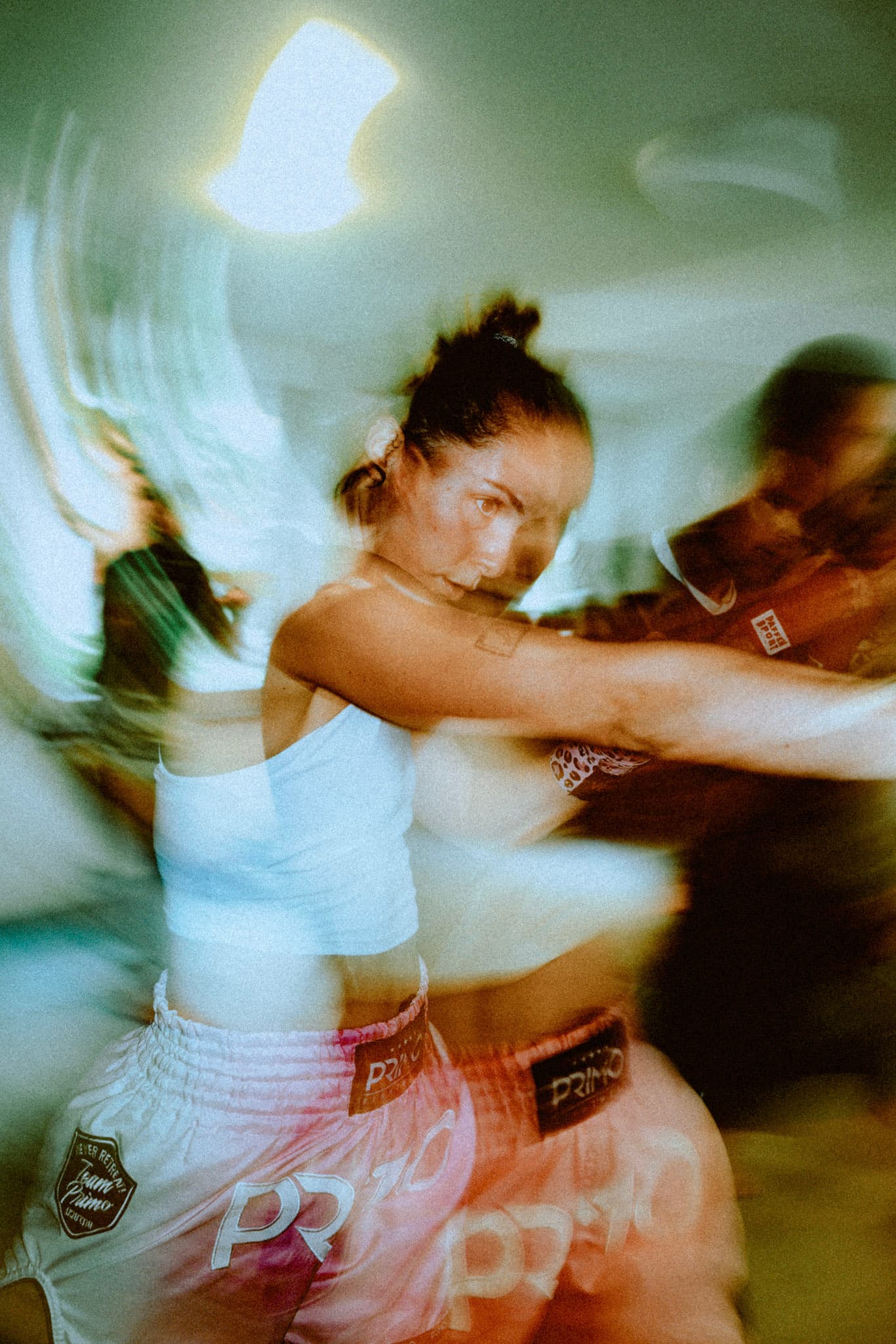 Picture of a girl punching in Muay Training. 